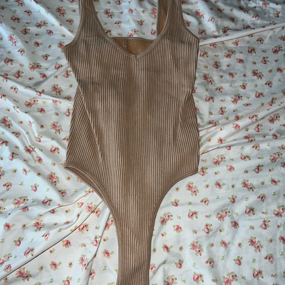 Beige tan body suit